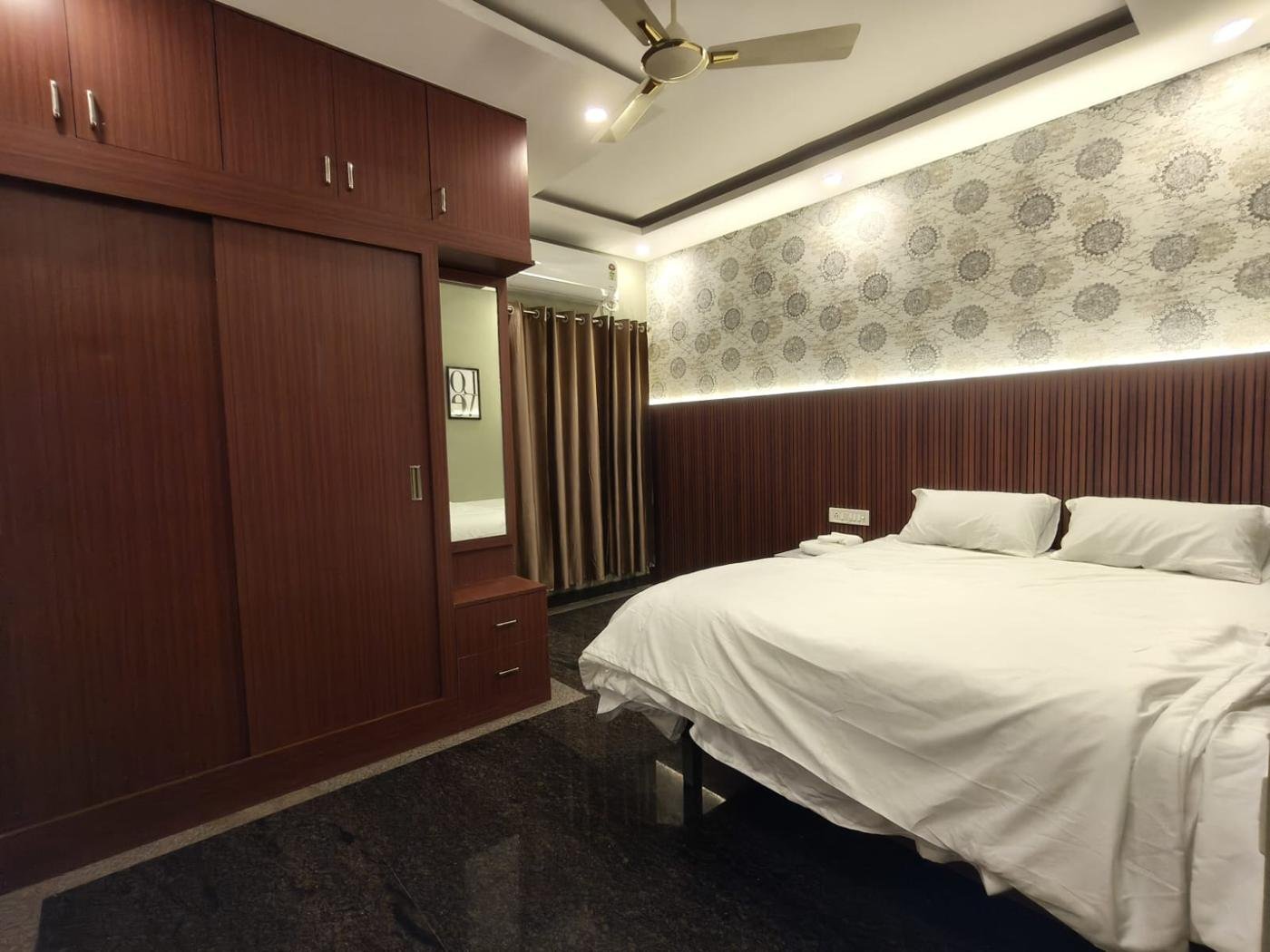 Bedroom with sliding wardrobe and dresser