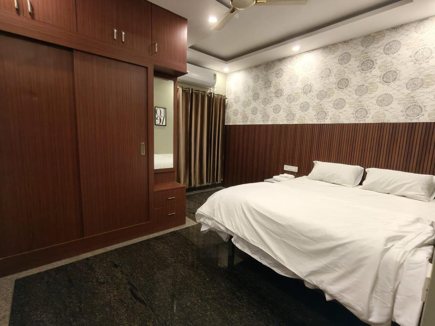 Bedroom with wardrobe and mirror