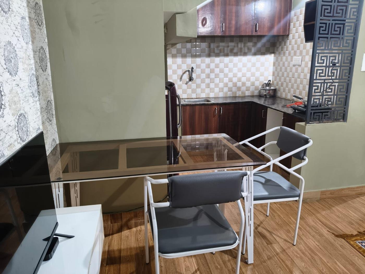 Kitchen with refrigerator, sink and cabinets