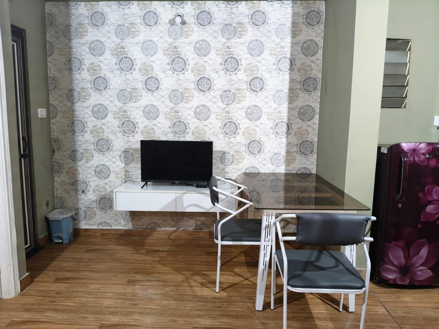 Living area with TV and dining table